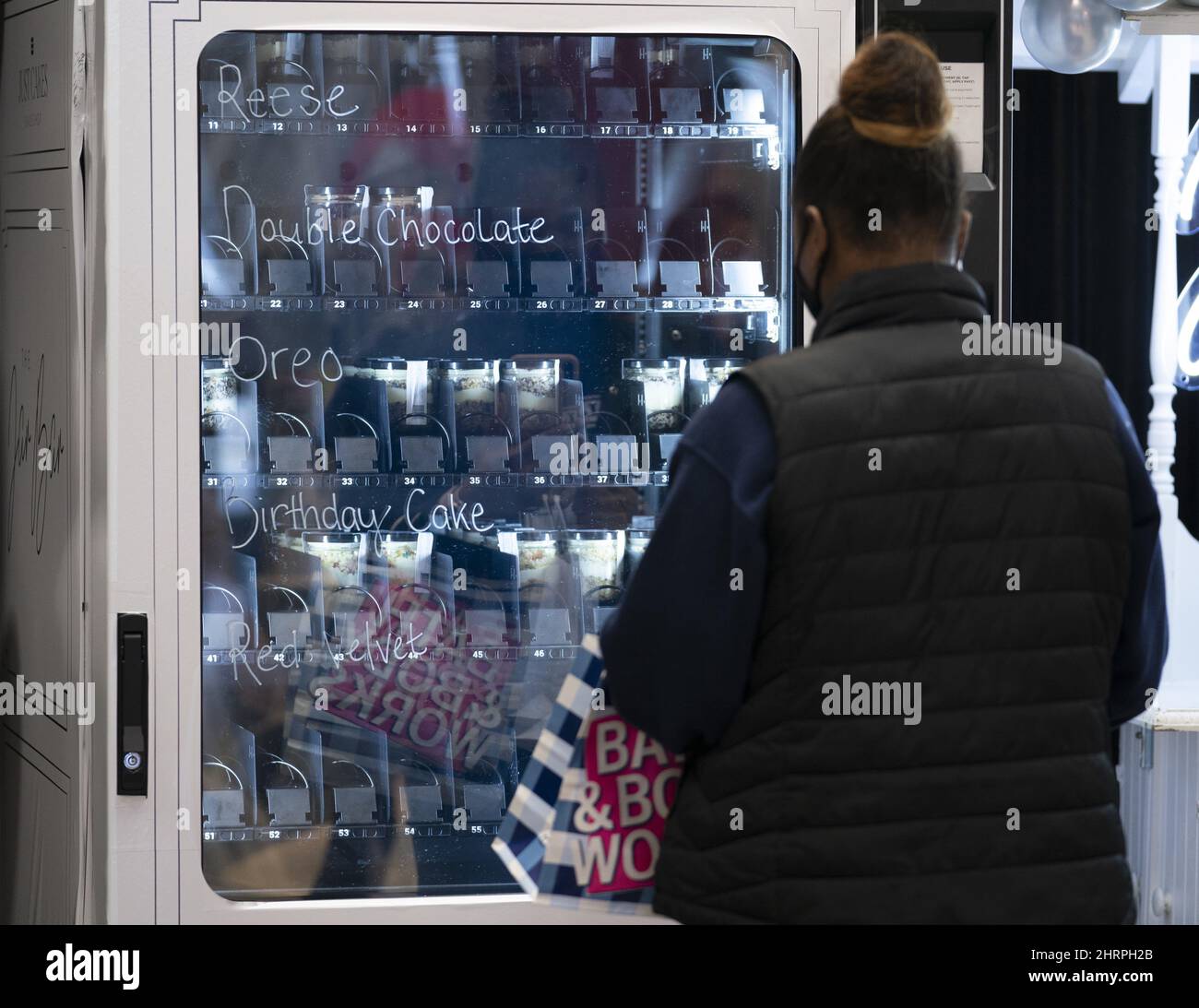 A customer purchases a cake in a jar, from the Jar Bar, CanadaÃ•s first