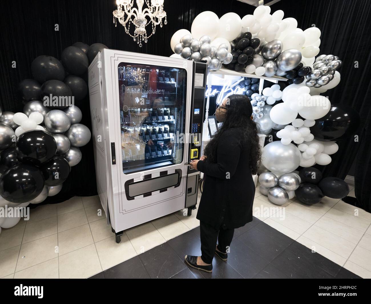 Customer Amrit Douhlani purchases a cake in a jar from the Jar Bar