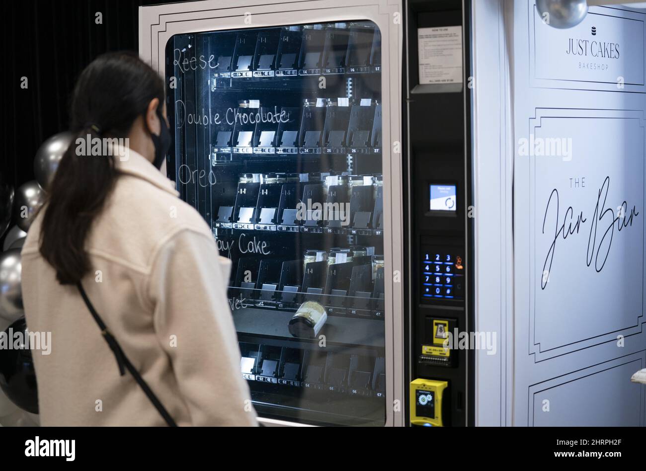 A customer purchases a cake in a jar, from the Jar Bar, CanadaÃ•s first