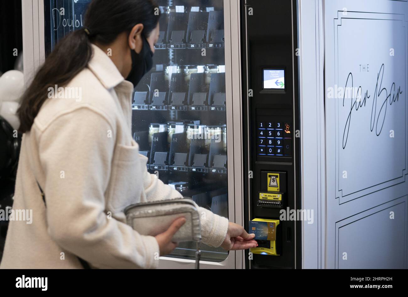 A customer purchases a cake in a jar, from the Jar Bar, CanadaÃ•s first