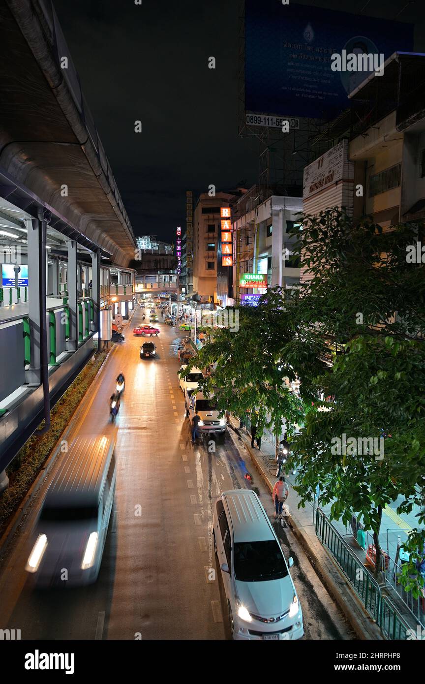 View of Nana BTS Train Station and southeast-bound evening traffic along Sukhumvit Road, Bangkok Jul 2019 Stock Photo