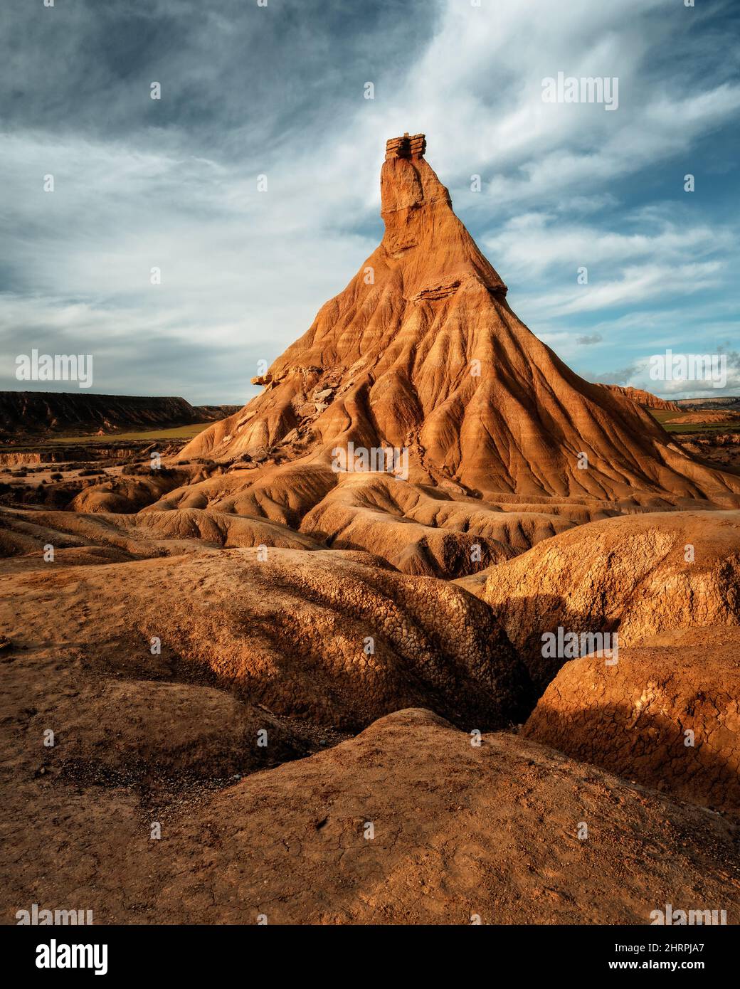 A vertical of a stone pyramid in a desert in the golden hour Stock ...