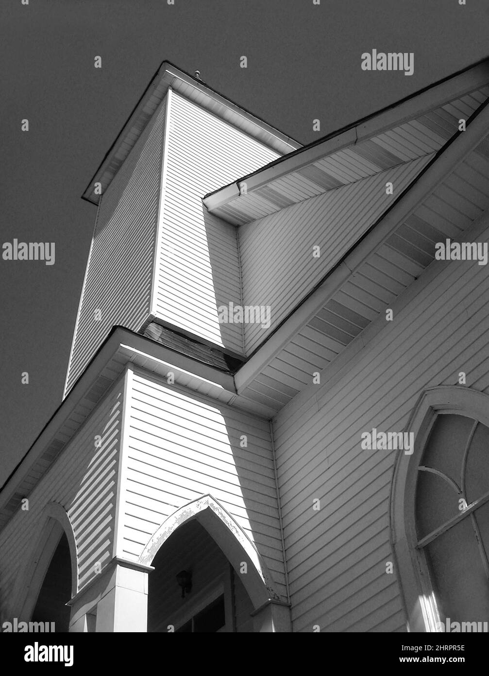 Low angle view of an old church facade shot in grayscale Stock Photo ...