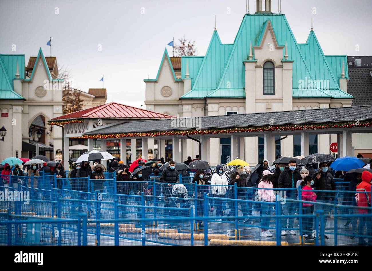 Hundreds of people wait in line to enter McArthur Glen Designer