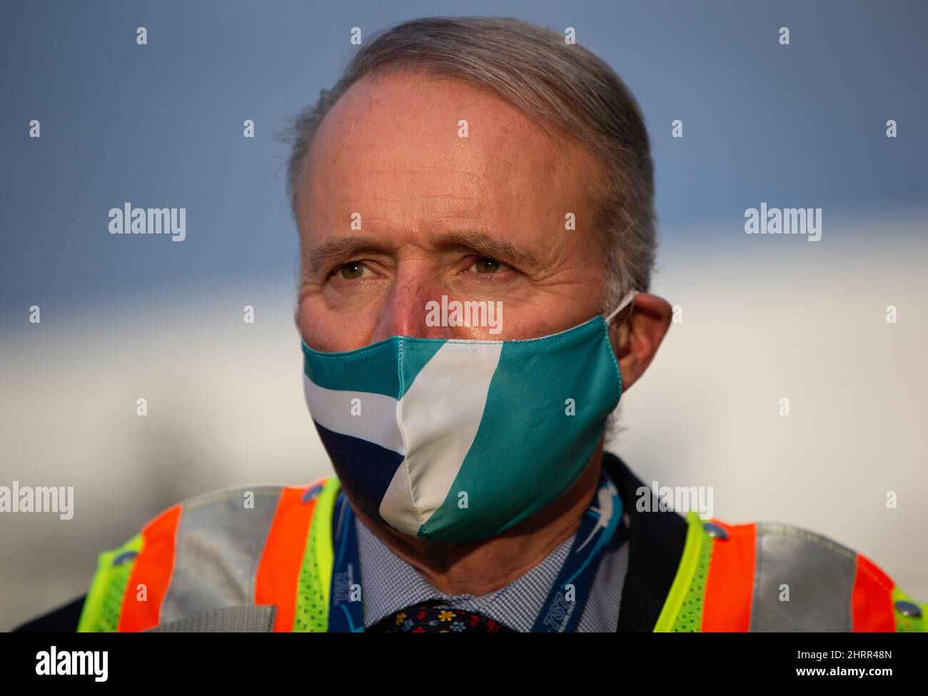 WestJet Airlines President and CEO Edward Sims wears a company branded