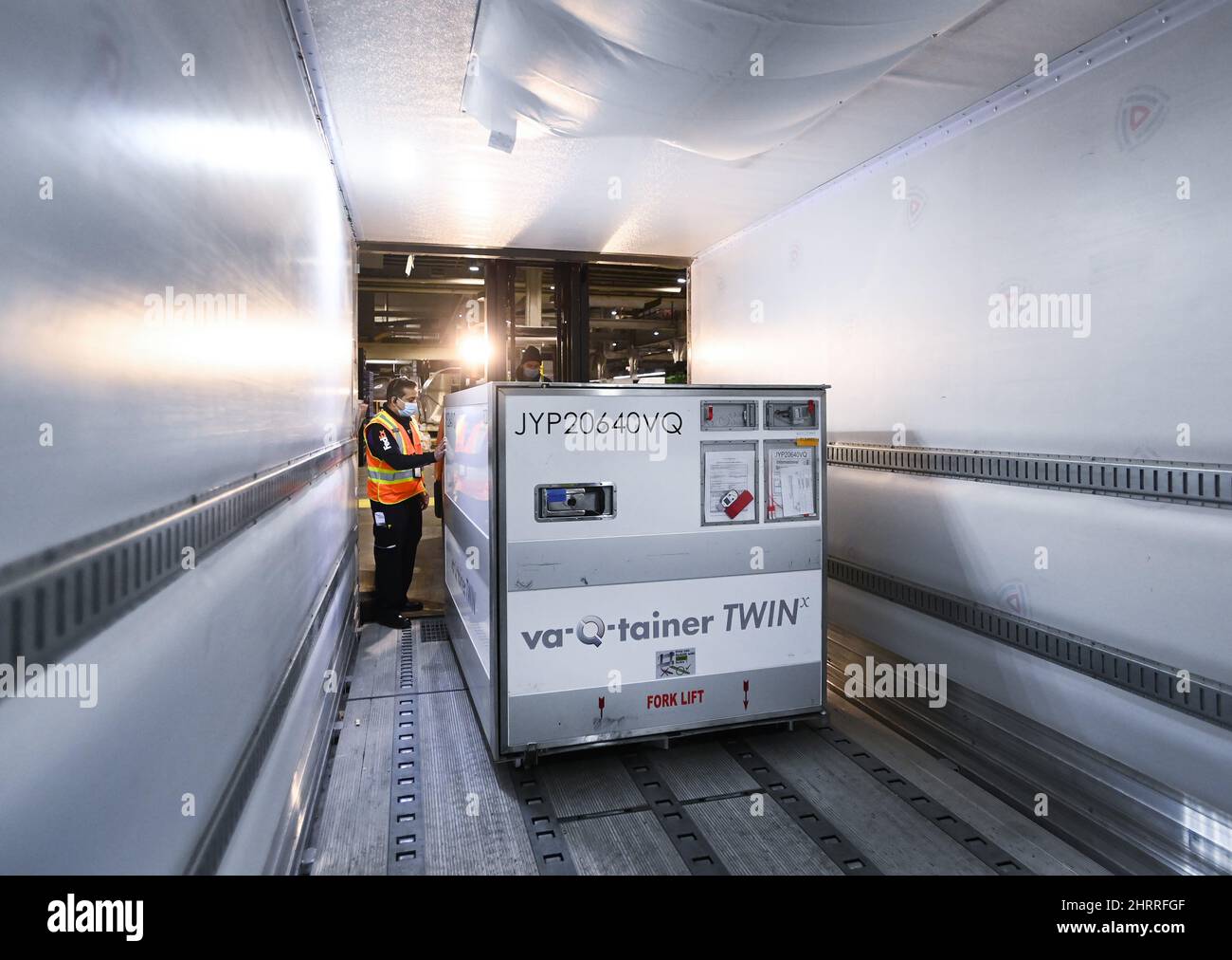 A FedEx worker loads the 255,600 doses of the Moderna COVID19 vaccine