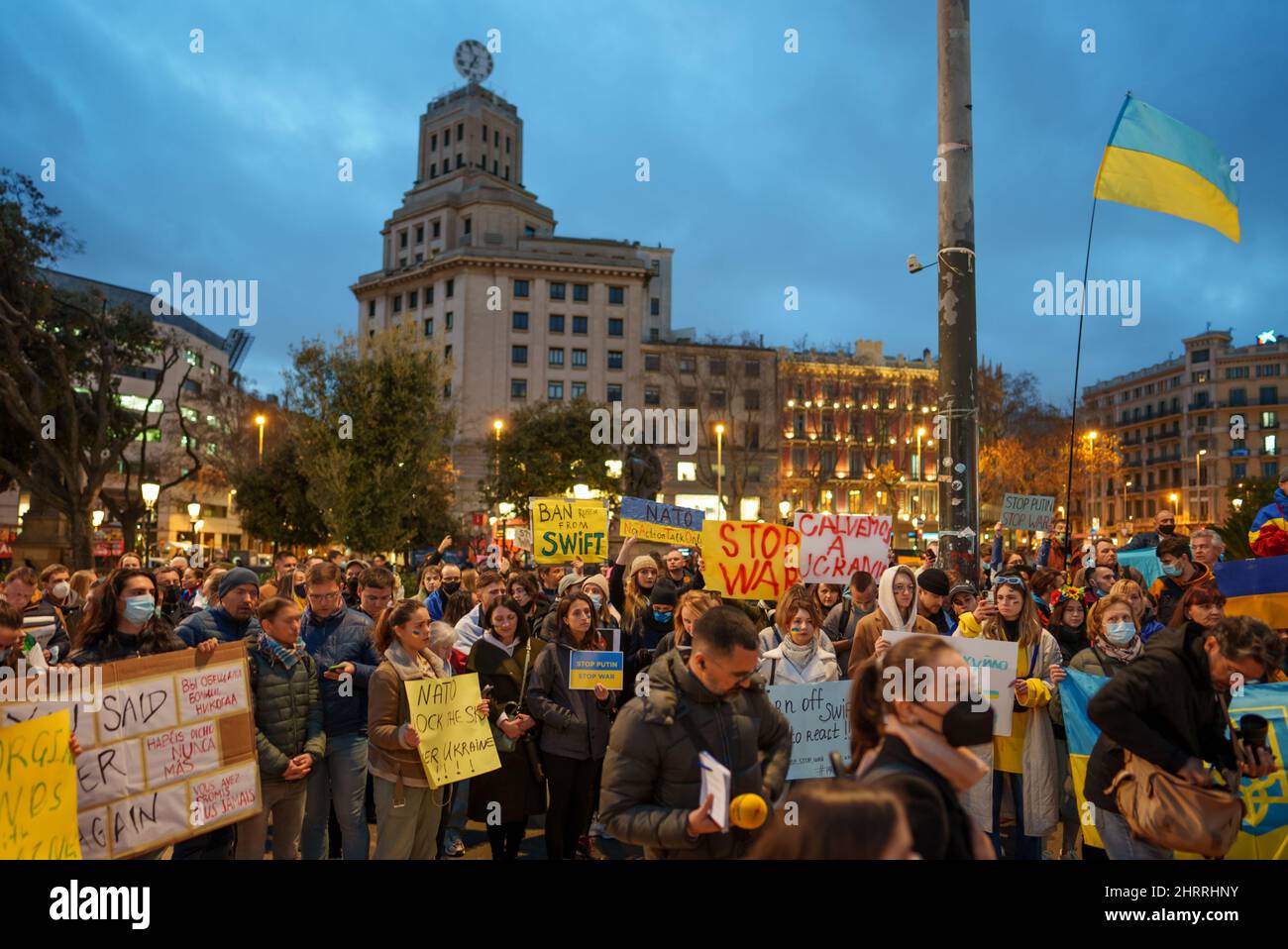 Barcelona, Spain - February 25, 2022: Protest against the war and russian aggressive Vladimir Putin politic. Ukrainians in Spain in defense of Ukraine on plaza Catalunya place. Global military conflict, invasion. Reportage editorial photo from Catalunya Stock Photo