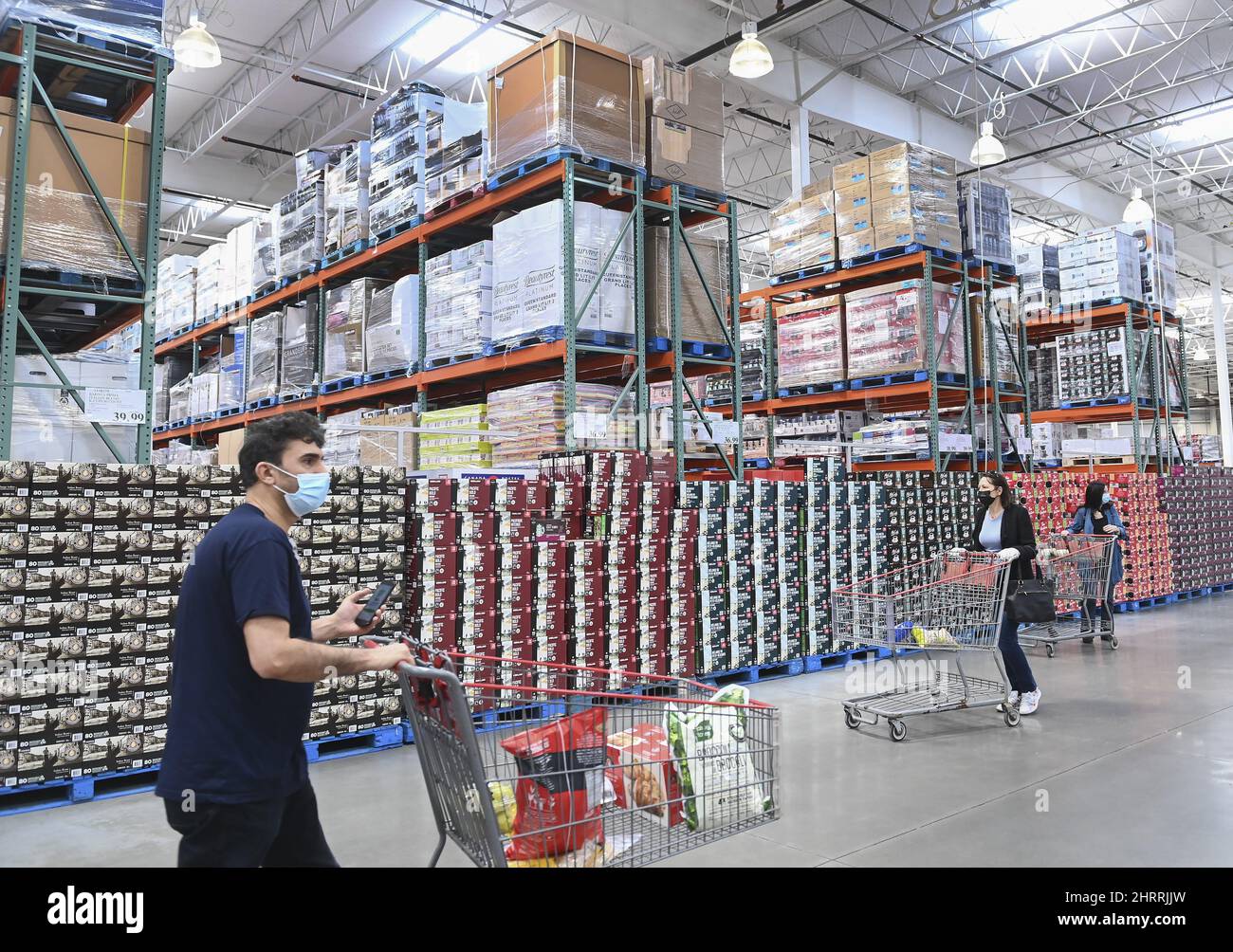 People shop for essential items only at Costco as the company was