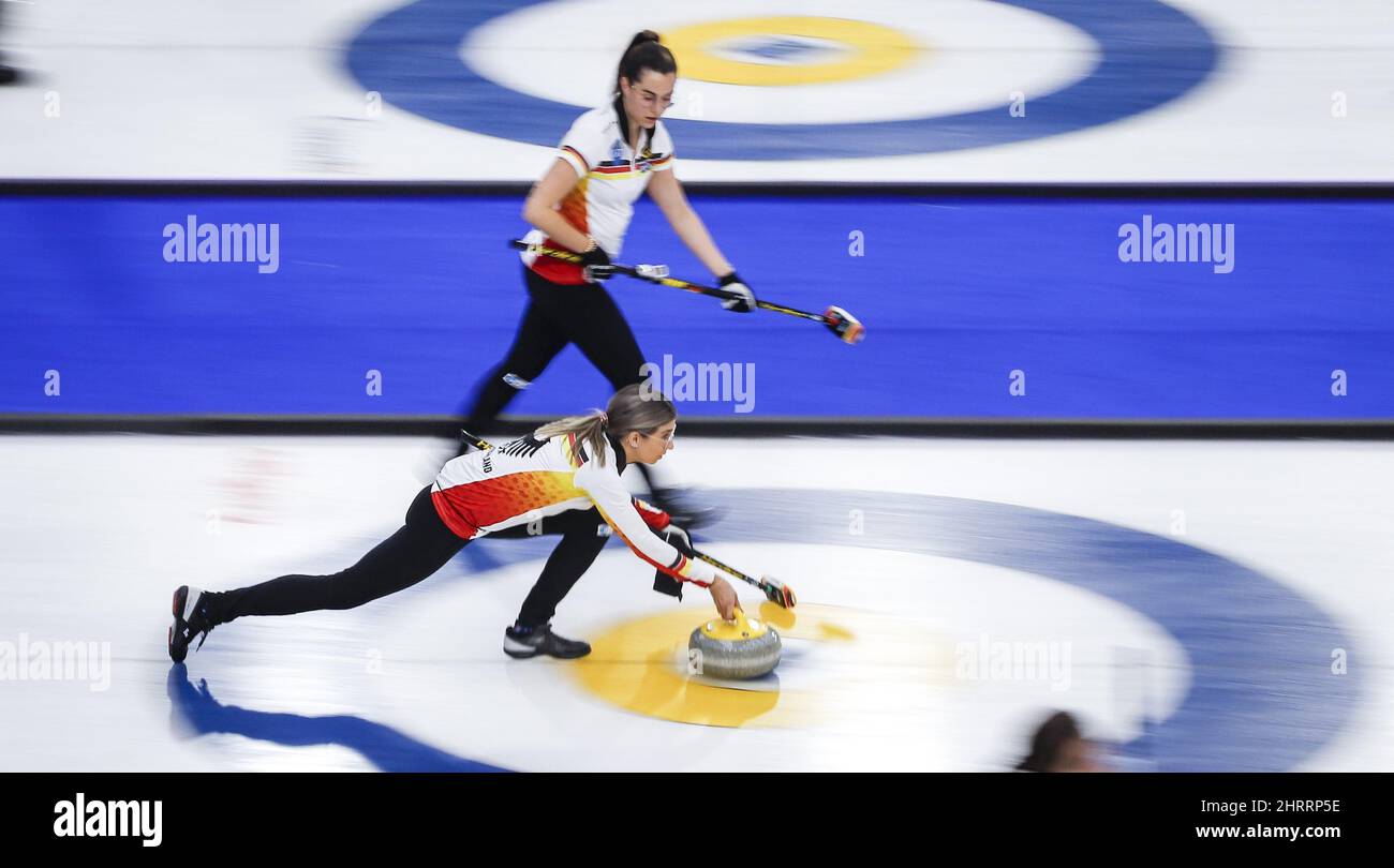 Germany skip Daniela Jentsch, bottom, makes a shot as lead Analena
