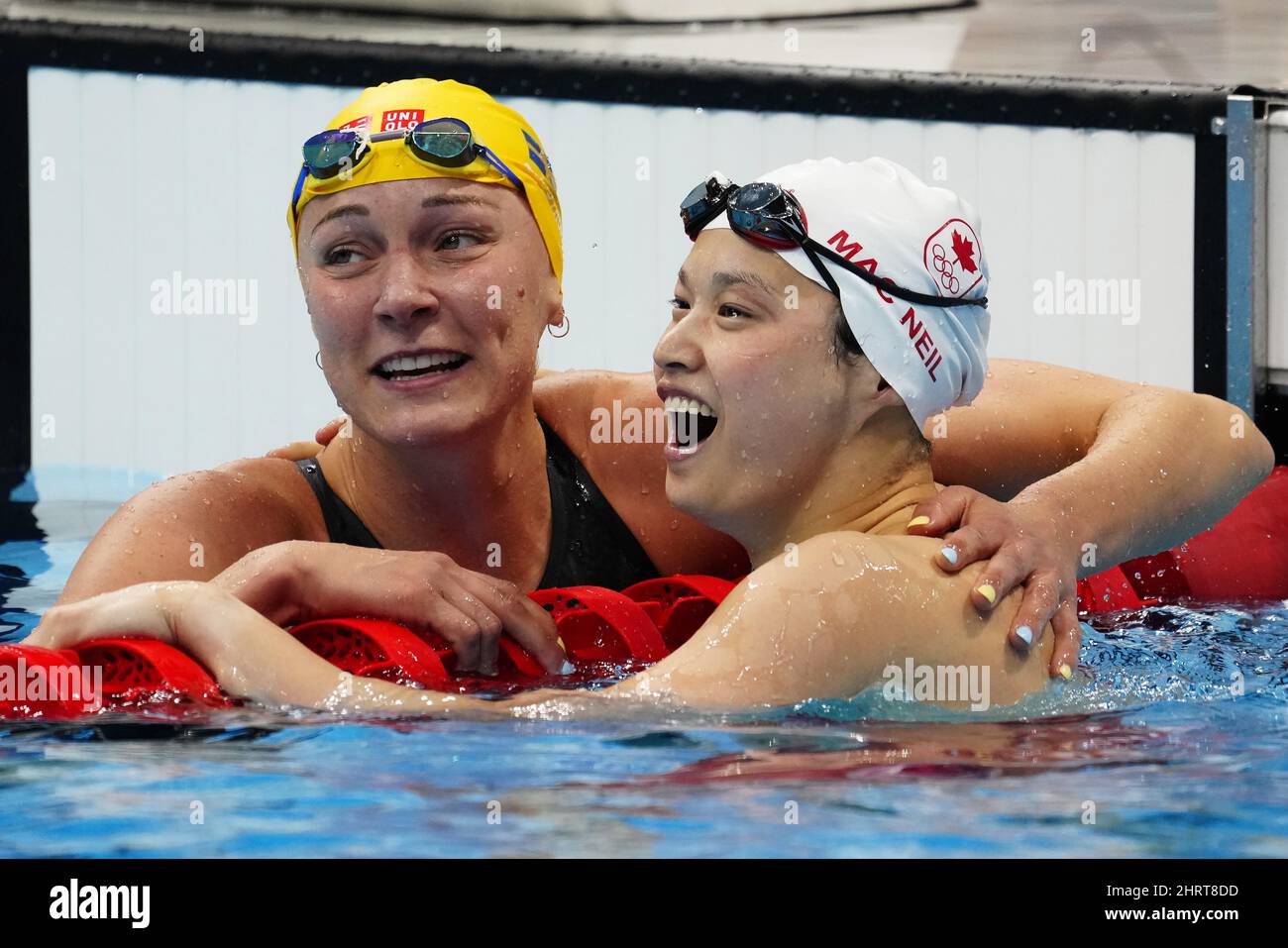 Canada's Margaret Mac Neil celebrates her gold medal swim in the women