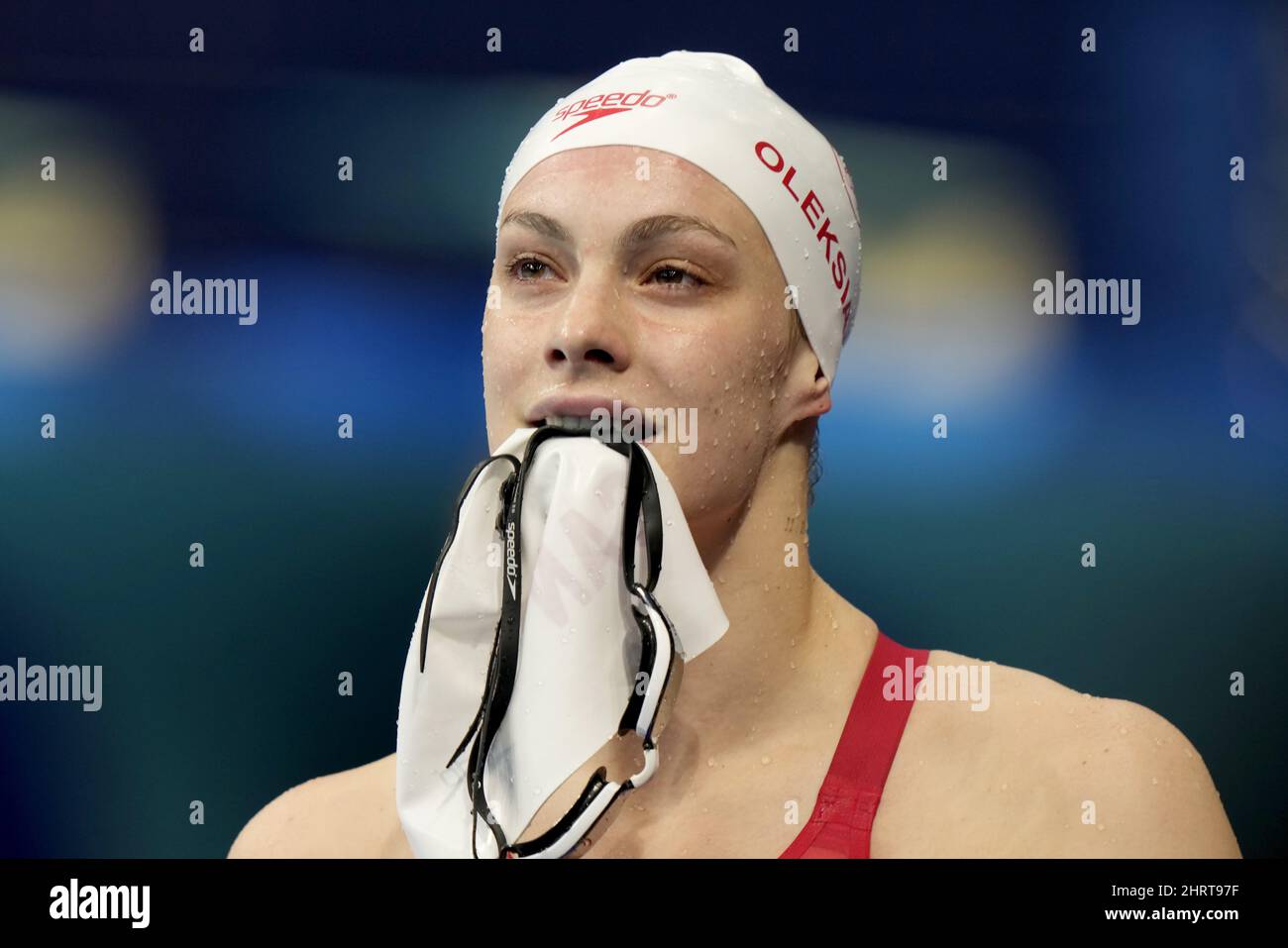 Canada's Penny Oleksiak carries her swim cap and goggles in her teeth