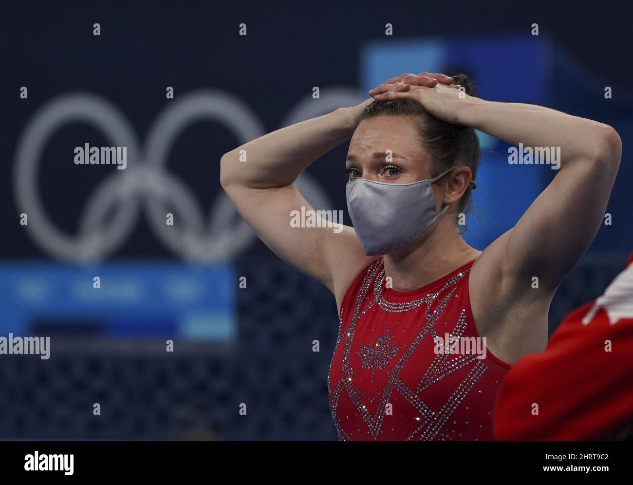 Canada's Rosie MacLennan tears up as she looks on following a fourth