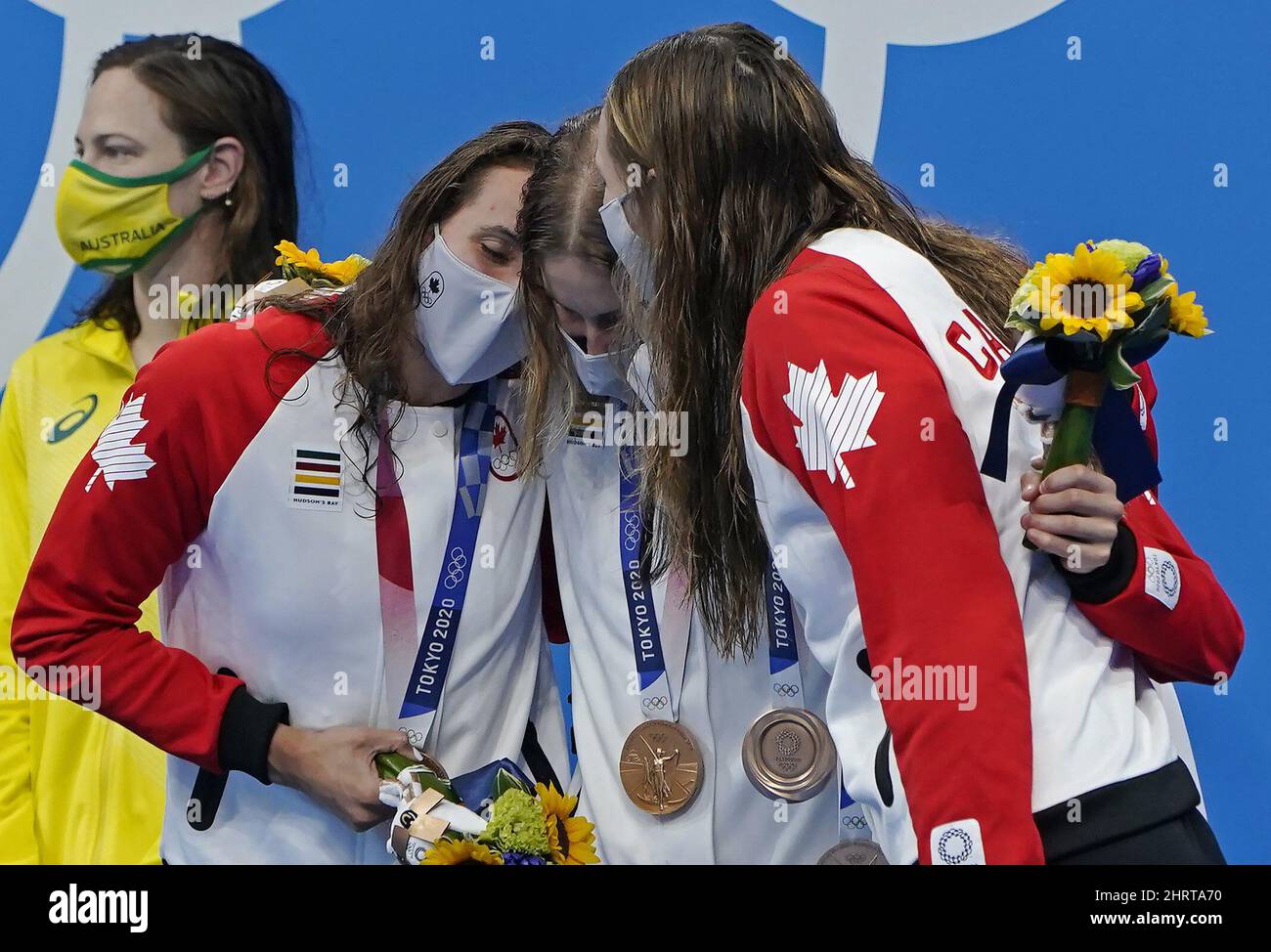 Canada's Kylie Masse, Sydney Pickrem, Maggie Mac Neil and Penny Oleksiak celebrate a bronze medal in the women's 4 x 100m medley relay final during the Tokyo Summer Olympic Games, in Tokyo, Sunday, August 1, 2021. THE CANADIAN PRESS/Adrian Wyld Stock Photo