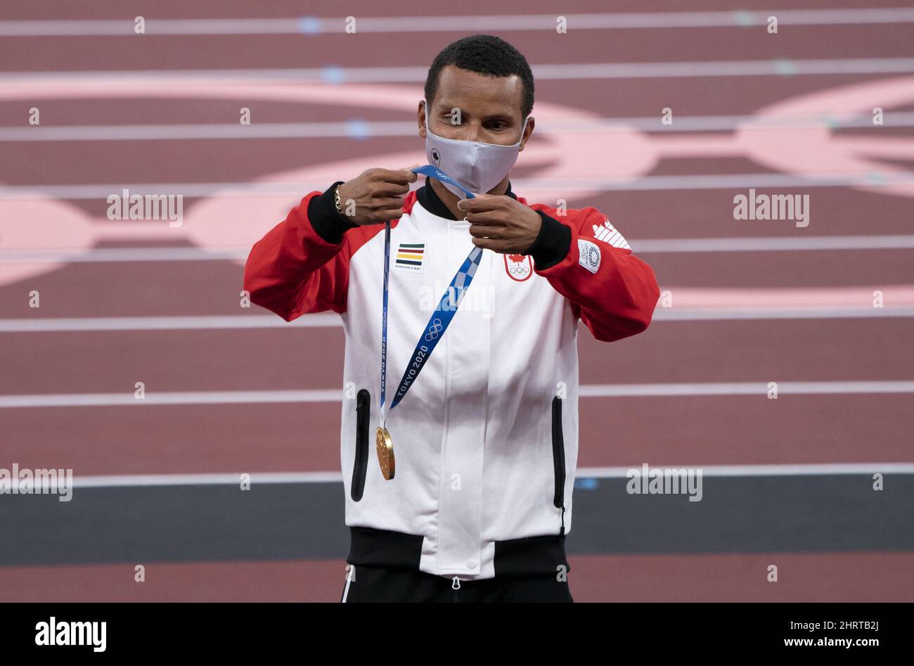 Canada‚Äôs Andre De Grasse From Markham Ont Puts On The Gold Medal During A Ceremony For The