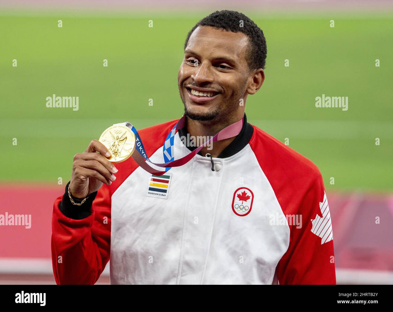 Andre De Grasse of Canada shows off his gold medal for the menâ€™s 200m