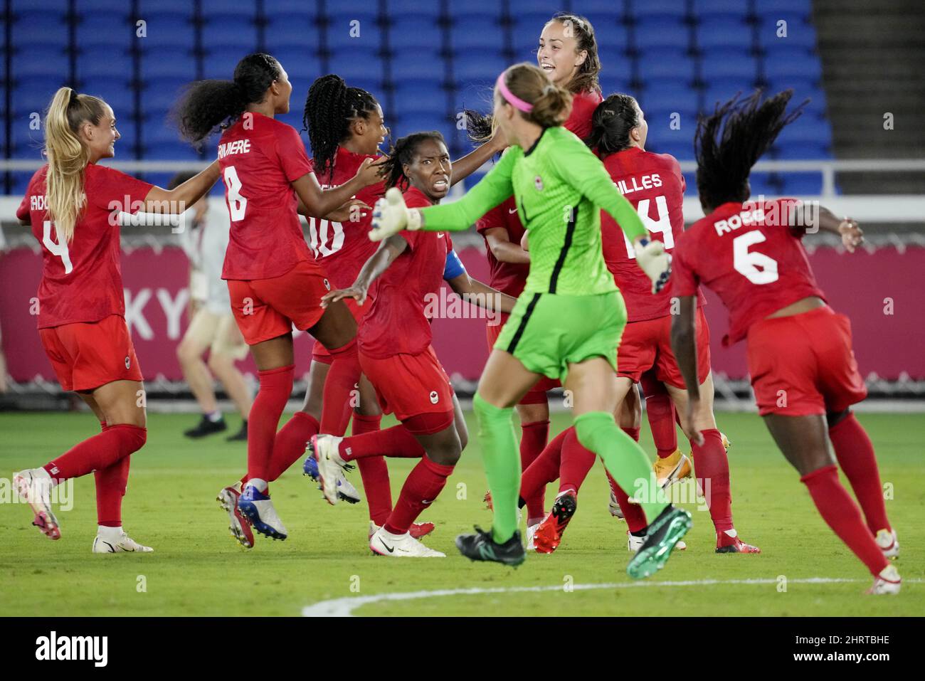 Canada celebrates after defeating Sweden in the penalty shootout in