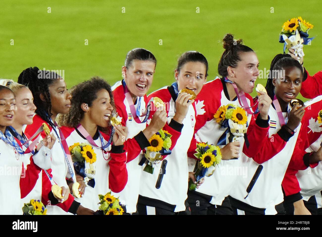 Canada celebrates with their gold medals after defeating Sweden in the