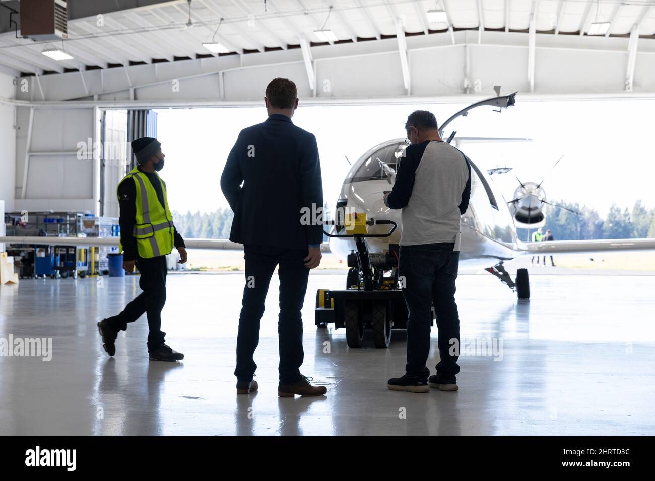 Arlington, Washington, USA. 25th February, 2022. Greg Davis (center