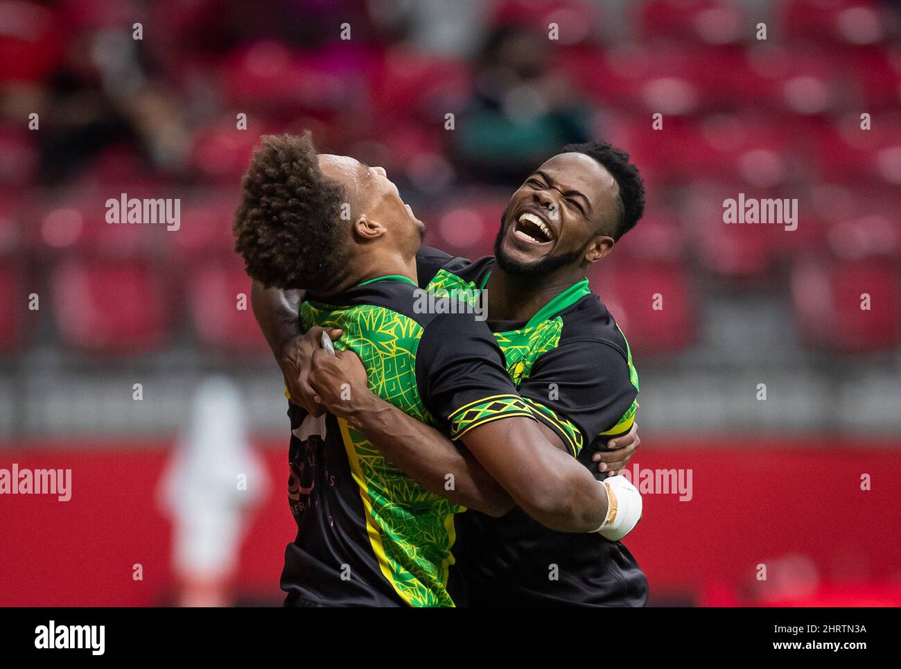 Jamaica's Jack Rampton, left, and Fabian Turner celebrate Rampton's try ...