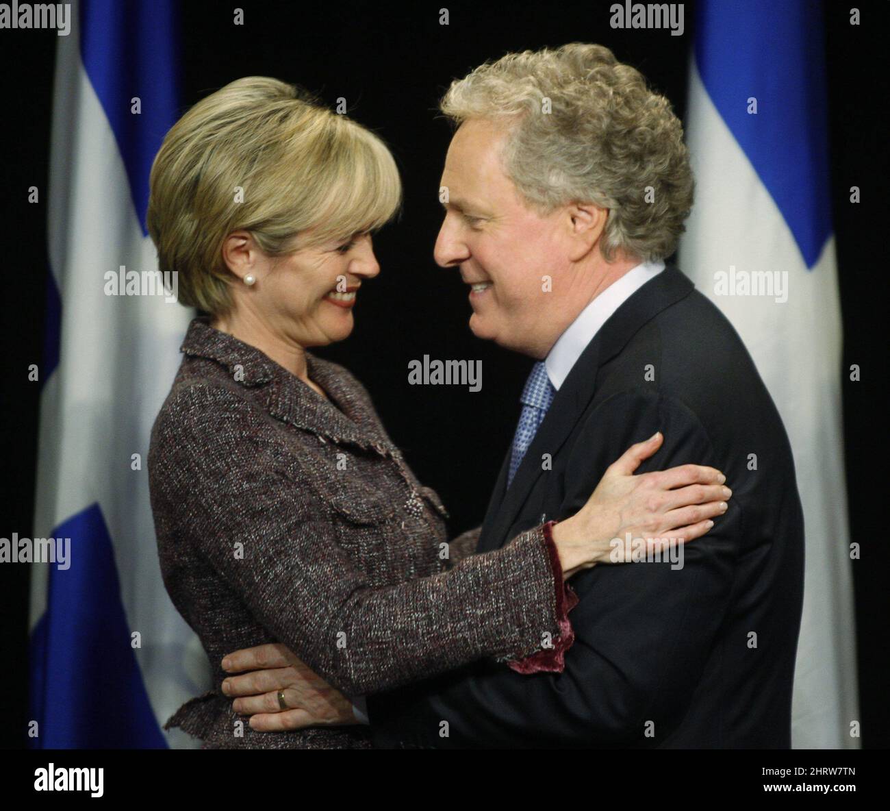 ADDS ID Quebec Premier Jean Charest hugs his wife Michele