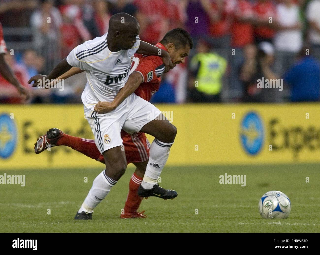 Real Madrid's Lassana Diarra, right, challenges Toronto FC's Amado Guevara during the first half of a friendly soccer match in Toronto on Friday, Aug. 7, 2009. (AP Photo/The Canadian Press, Chris Young) Stock Photo
