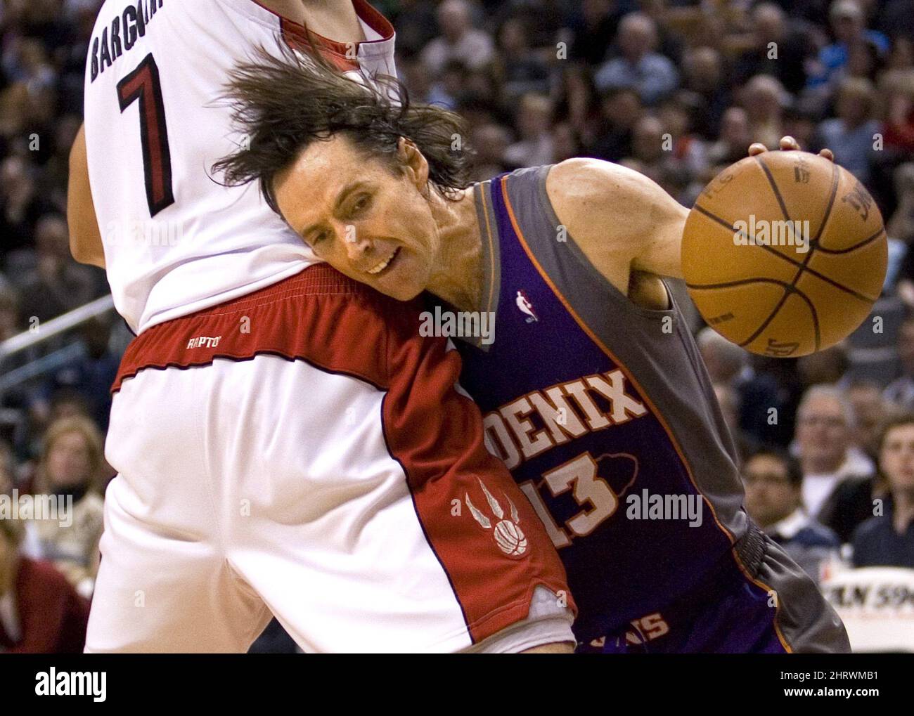 Pheonix Suns' Steve Nash (right) drives past Toronto Raptors' Andrea Bargnani during half NBA action in Toronto on Sunday November 29, 2009. THE CANADIAN PRESS/Chris Young Stock Photo