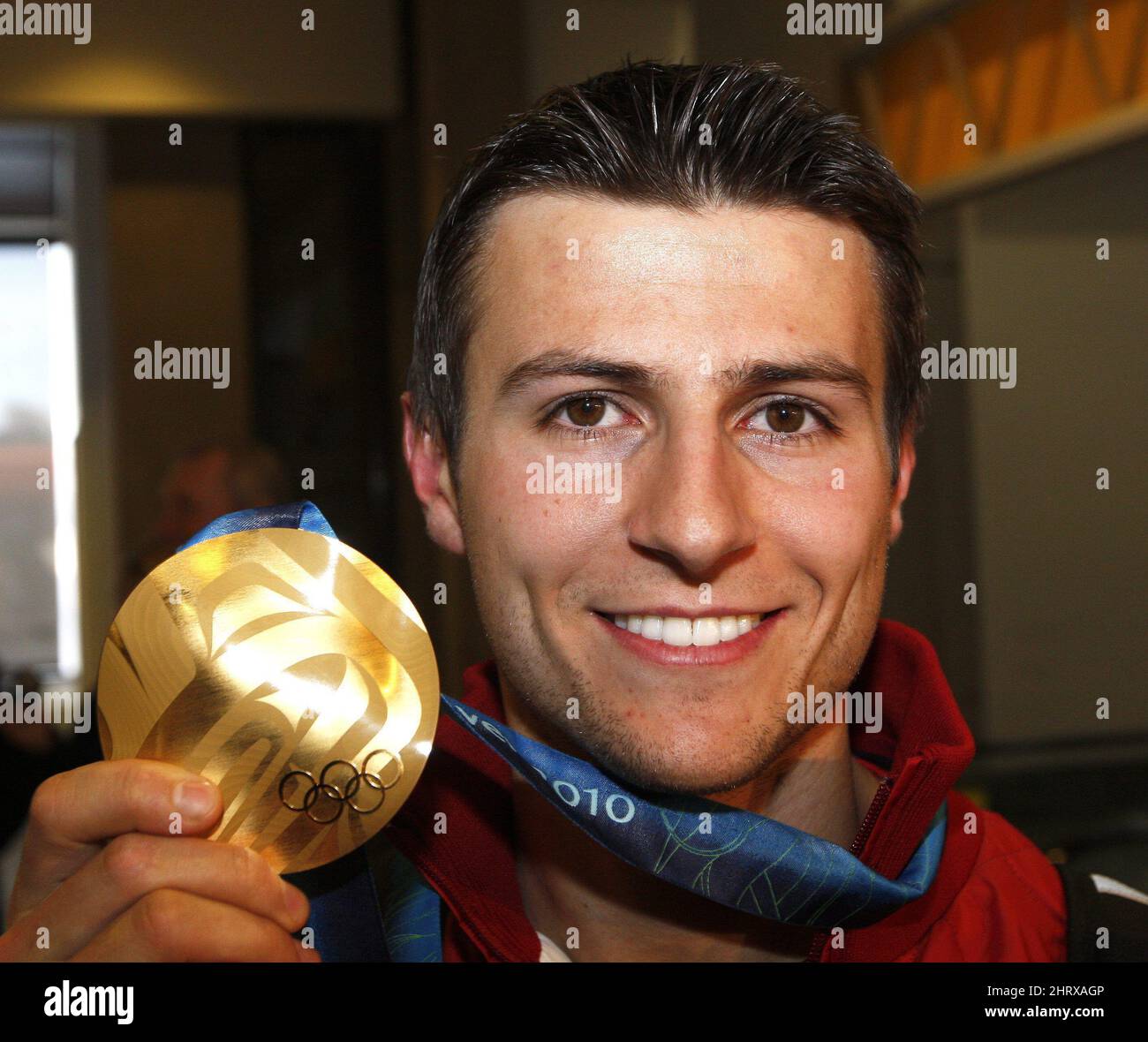 Team pursuit speed skating gold medalist Lucas Makowsky shows off his
