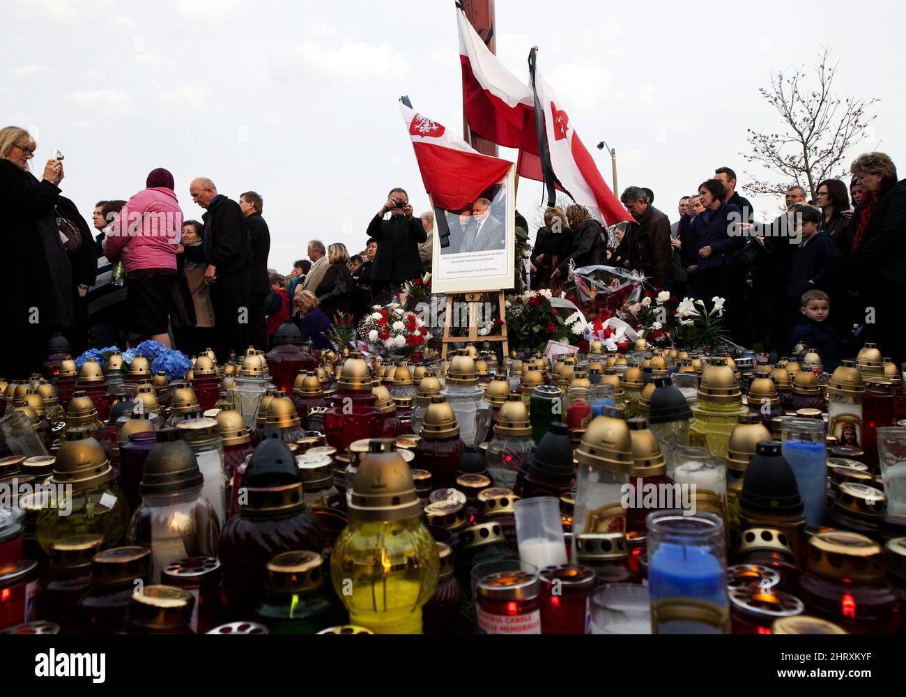 People light candles before a memorial mass in Mississauga, Ont., on