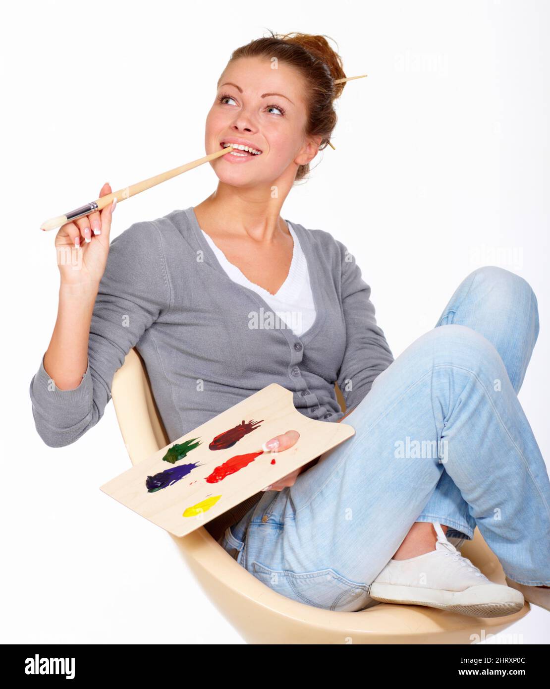 Thoughtful woman holding paint brush hi-res stock photography and ...