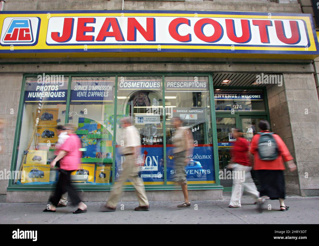 FILE--Pedestrians walk past a Jean Coutu pharmacy in Montreal, Thursday,  Sept. 15, 2005. The Jean Coutu Group more than quadrupled its first-quarter  profit, as the Quebec-based pharmacy chain increased revenue and continued