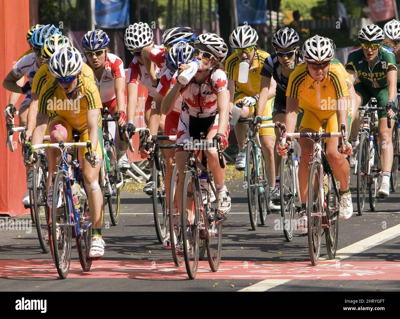 Canada's Erinne Willock, center, drinks some water as she competes in