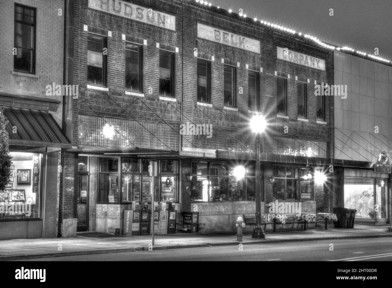 Greyscale street view of Hudson Belk Company at night in Thomasville