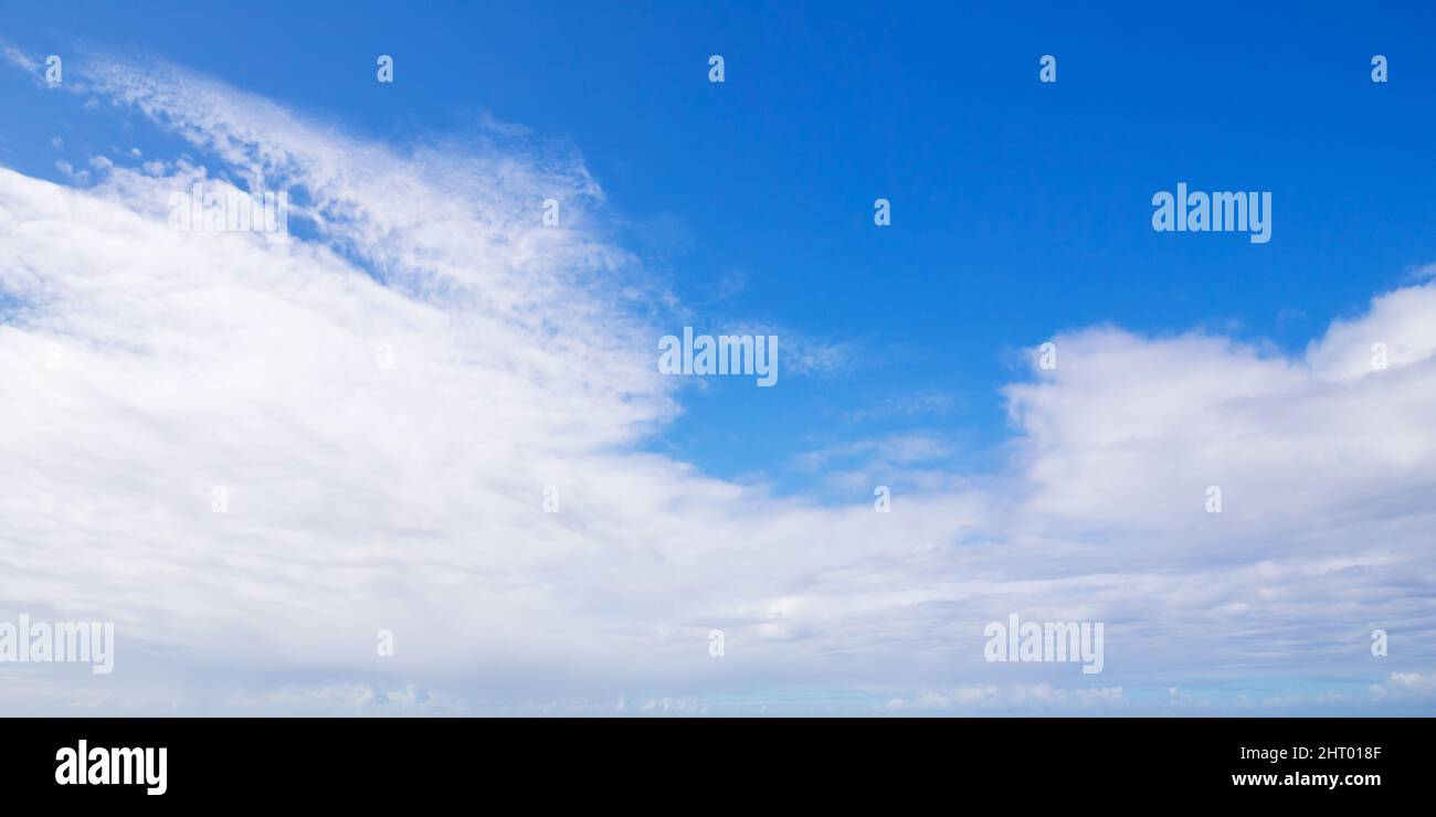 Blue sky with white clouds on a daytime, natural panoramic background photo Stock Photo