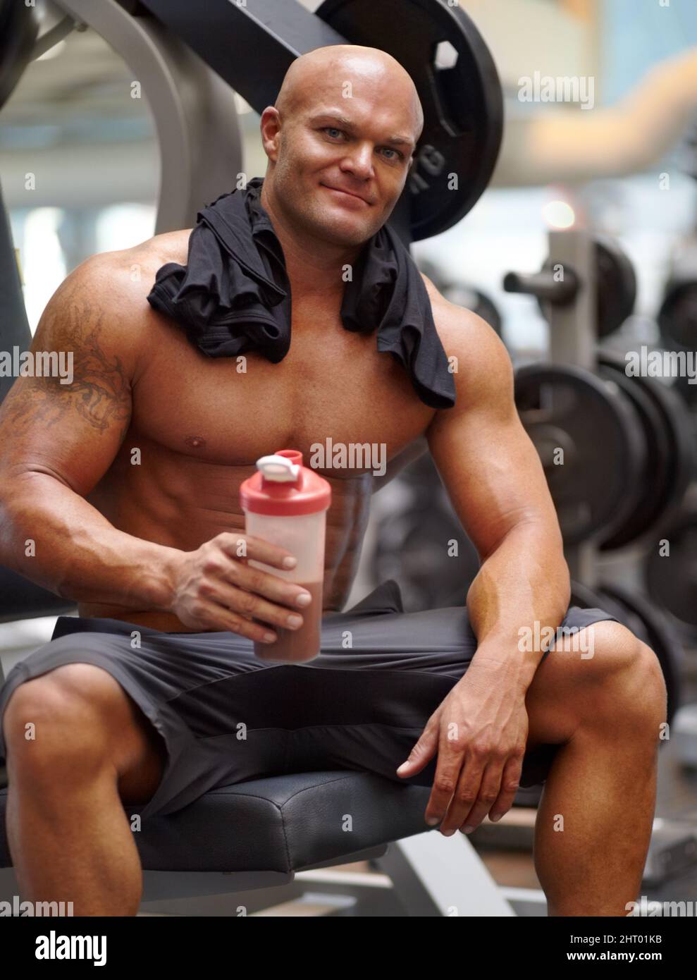 Enjoying a protein shake after a workout. Portrait of a male