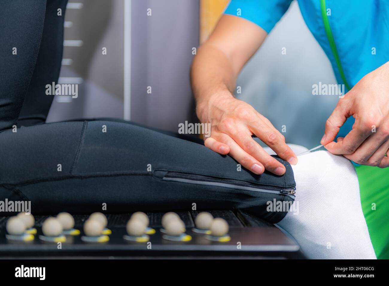 Placing markers for gait analysis Stock Photo