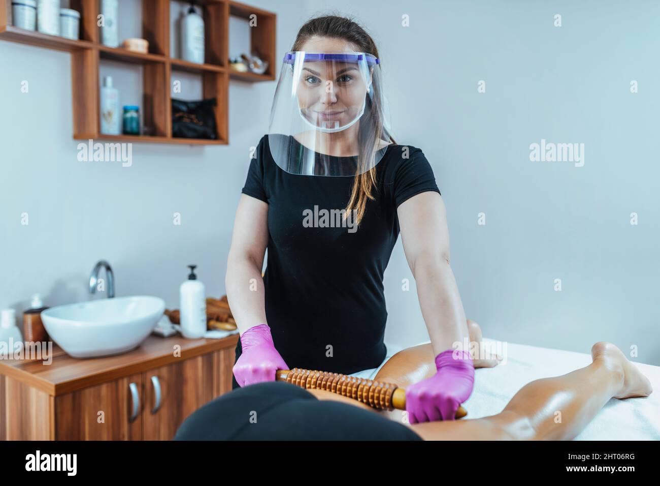 Madero massage therapist wearing PPE Stock Photo Alamy