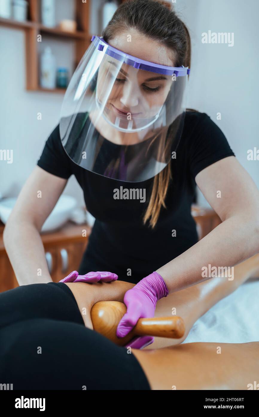 Madero massage therapist wearing PPE Stock Photo Alamy