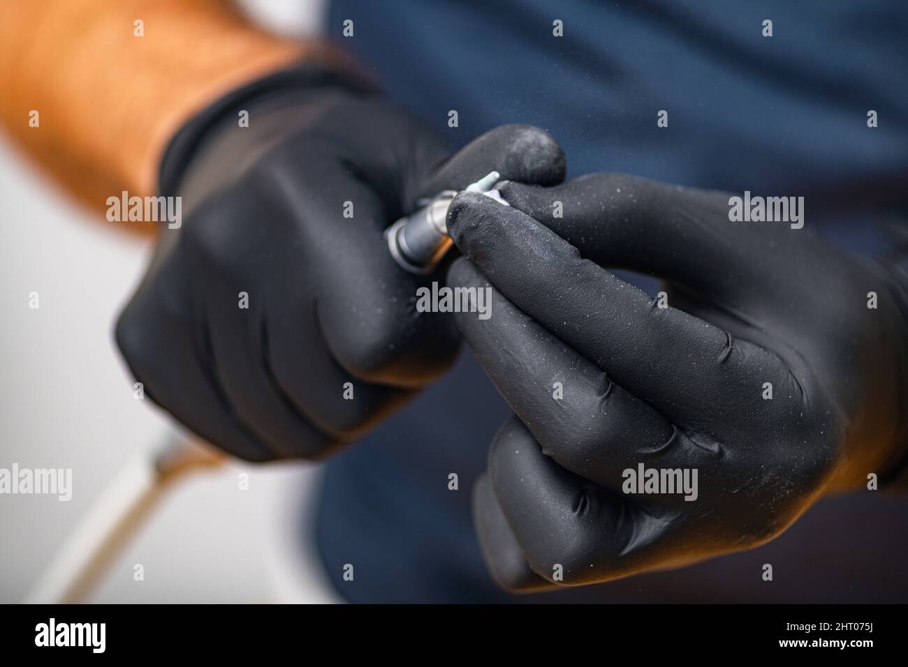 Dental technician shaping and polishing a dental crown Stock Photo Alamy
