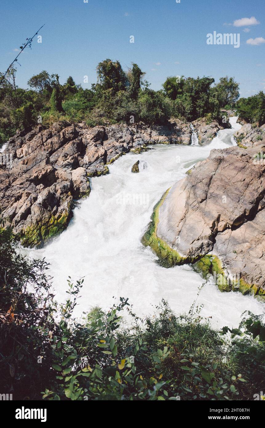 Vertical shot of Li Phi Falls, Tat Somphamit Waterfalls. Laos. Stock Photo