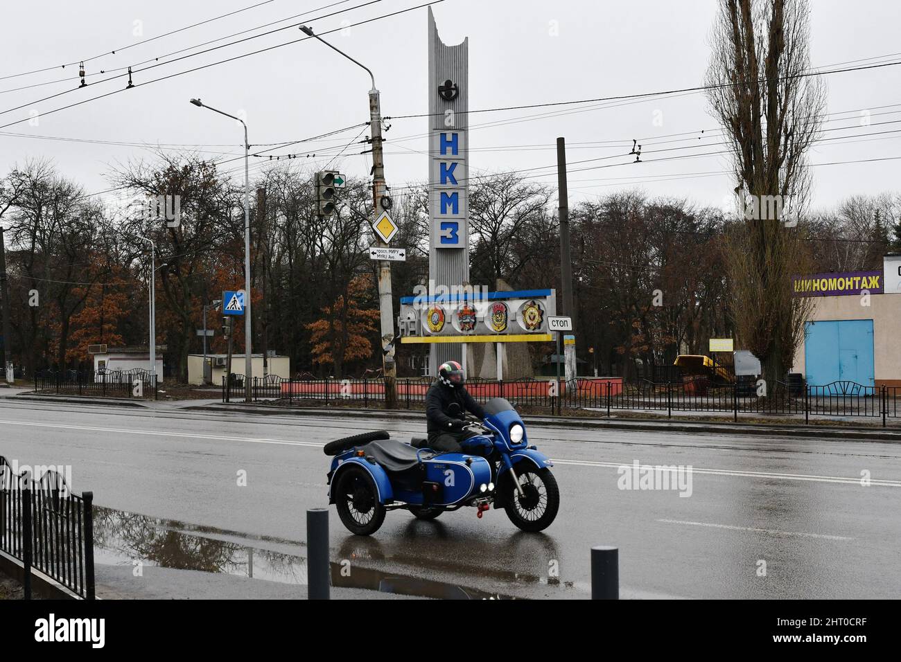 A man is seeing riding a retro motorcycle on the empty highway in the  Kramatorsk. Russian President Vladimir Putin ordered the military  intervention February 24, days after recognizing two separatist-held  enclaves in