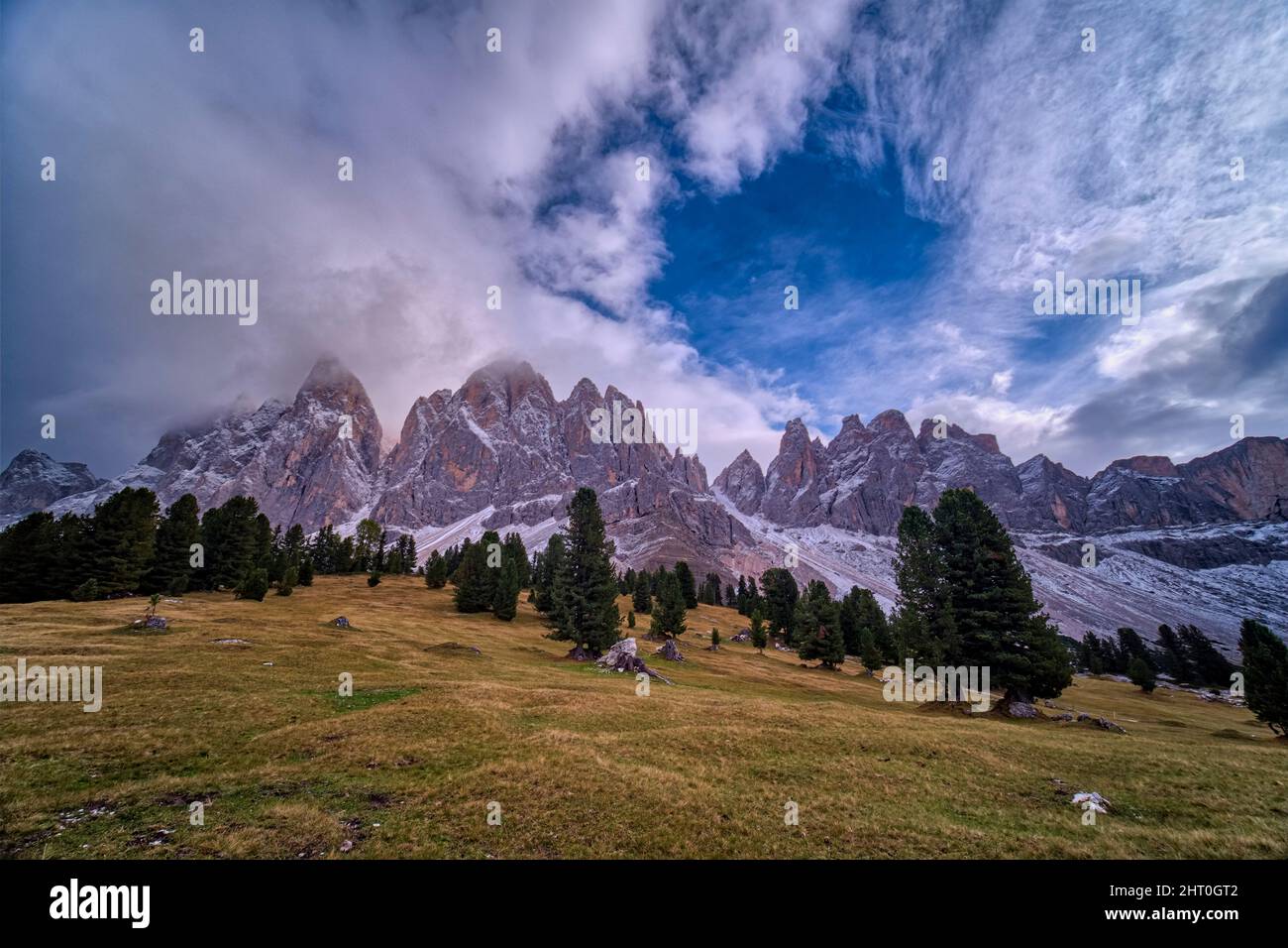 View of north faces and summits of Odle group, seen from Malga Geisler in autumn. Stock Photo
