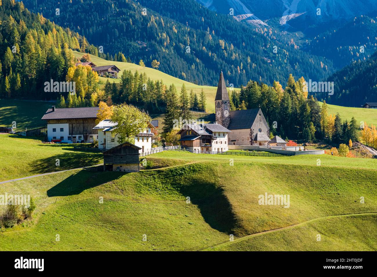 View of the Church of St. Magdalena in Villnöss valley in autumn. Stock Photo