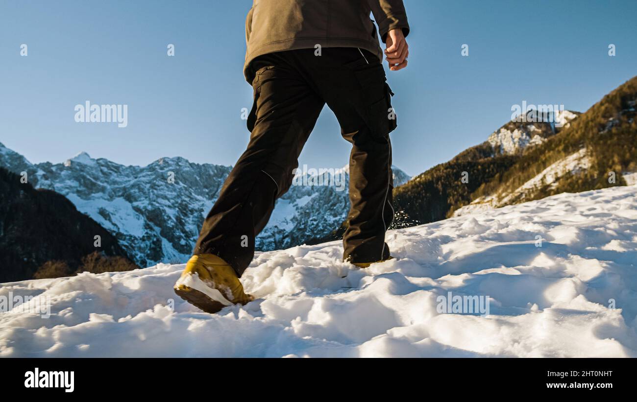 Young man hiking through hi-res stock photography and images - Alamy