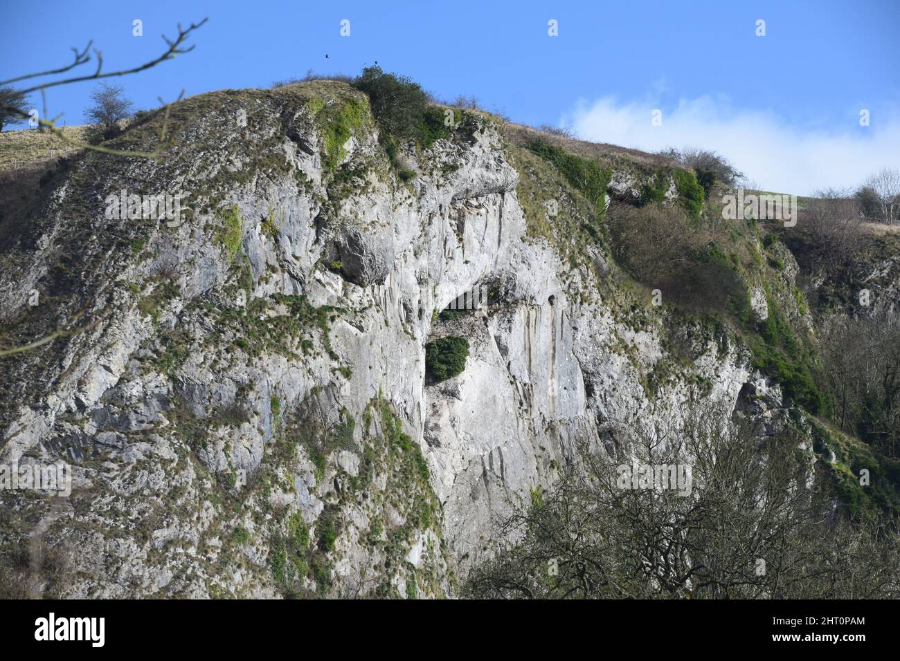 A February walk through the valley of the River Manifold showing the limestone cliffs on it's flanks within the peak district national park. Stock Photo