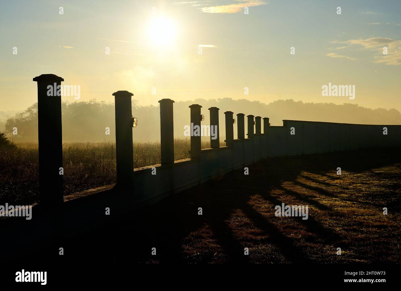 Sun Rising Over Fence Sunrise over rural fence hi-res stock photography and images - Alamy