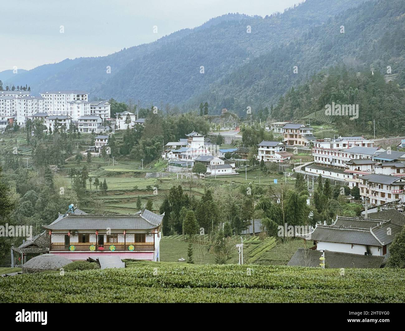 Aerial view of a town in green mountains Stock Photo - Alamy