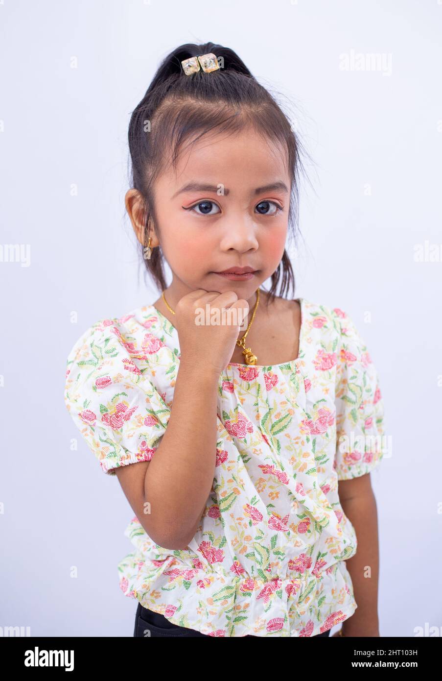 Closeup of a little girl posing on white background Stock Photo - Alamy