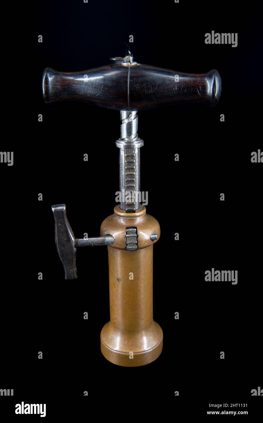 Vintage antique Kings screw corkscrew on black background Stock Photo