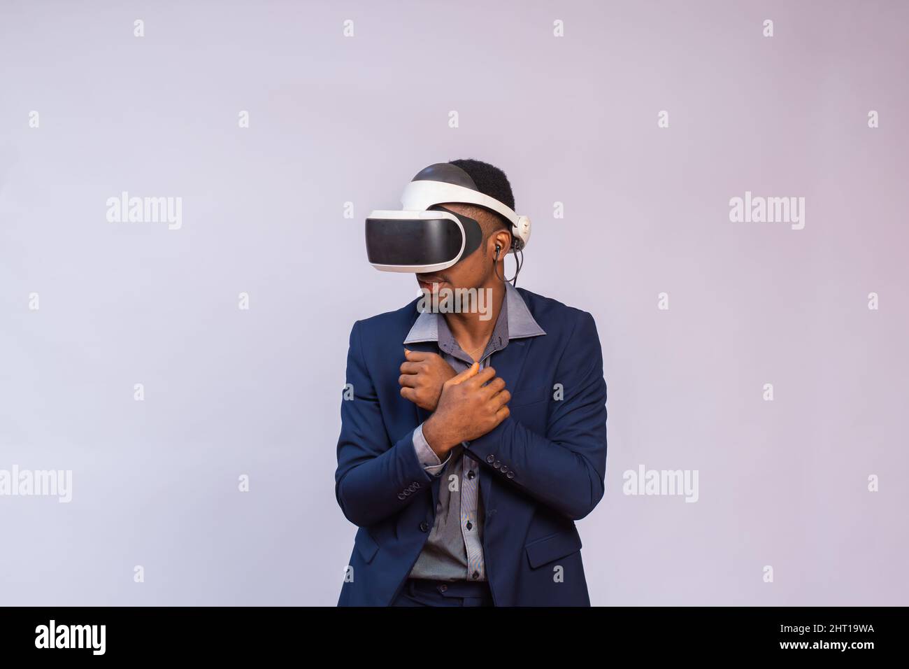 African businessman wearing virtual reality glasses isolated on a white ...