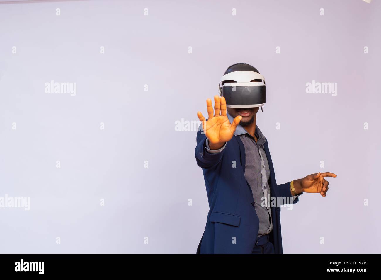 African businessman wearing a virtual reality glasses isolated on a ...